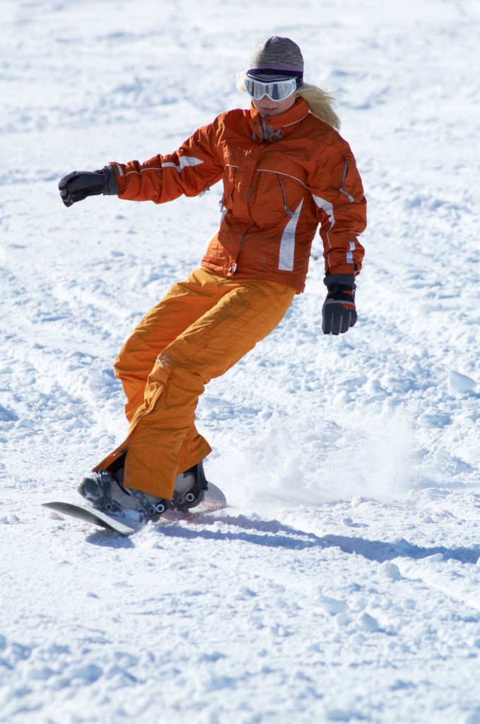 orange snowboard girl downhill