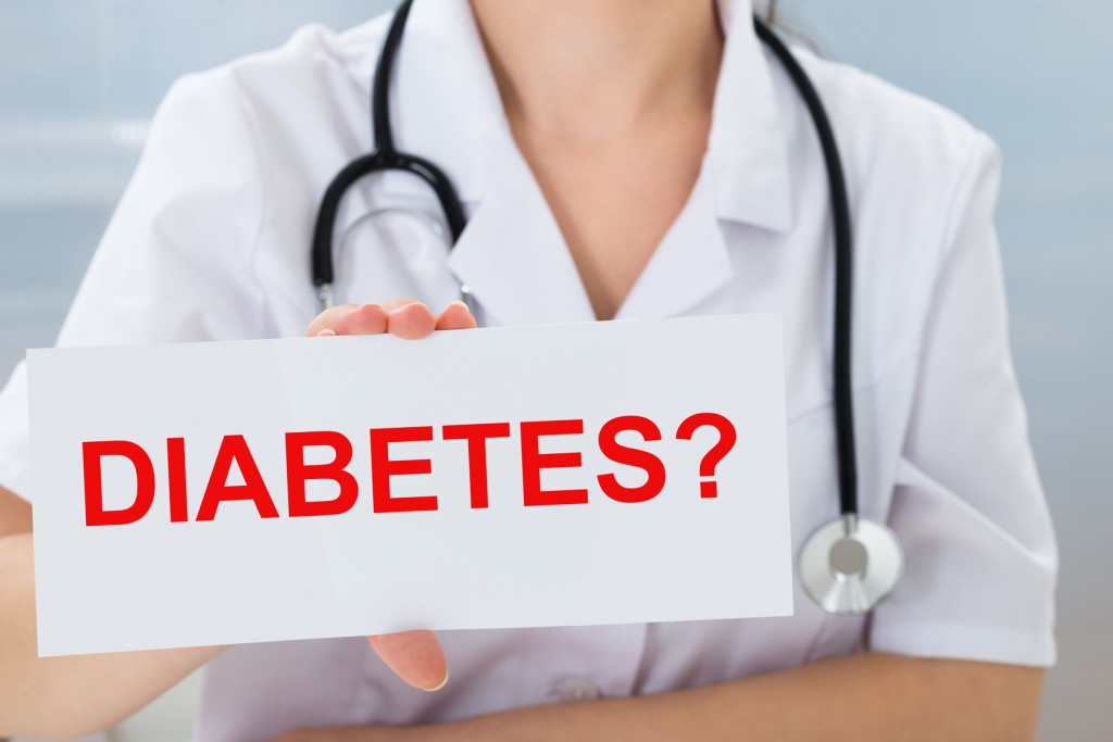 Close-up Of Female Doctor Holding Placard With Text Diabetes